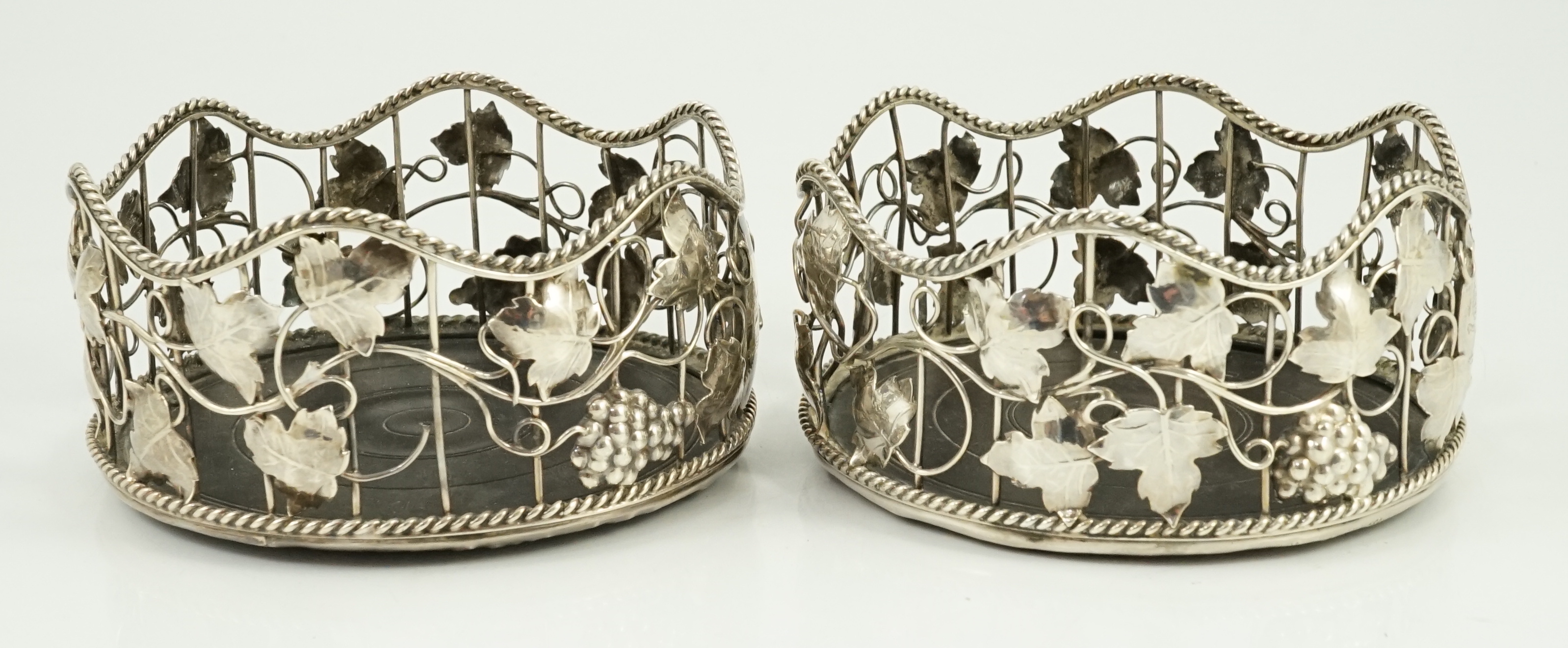 A pair of George III silver mounted wine coasters, by William Plummer